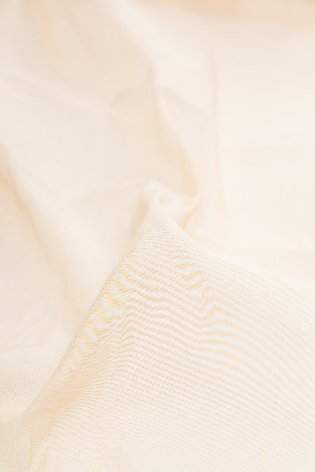 Close up of Off White Kerala Cotton Saree with Plain Body and Temple Border.  displaying folds