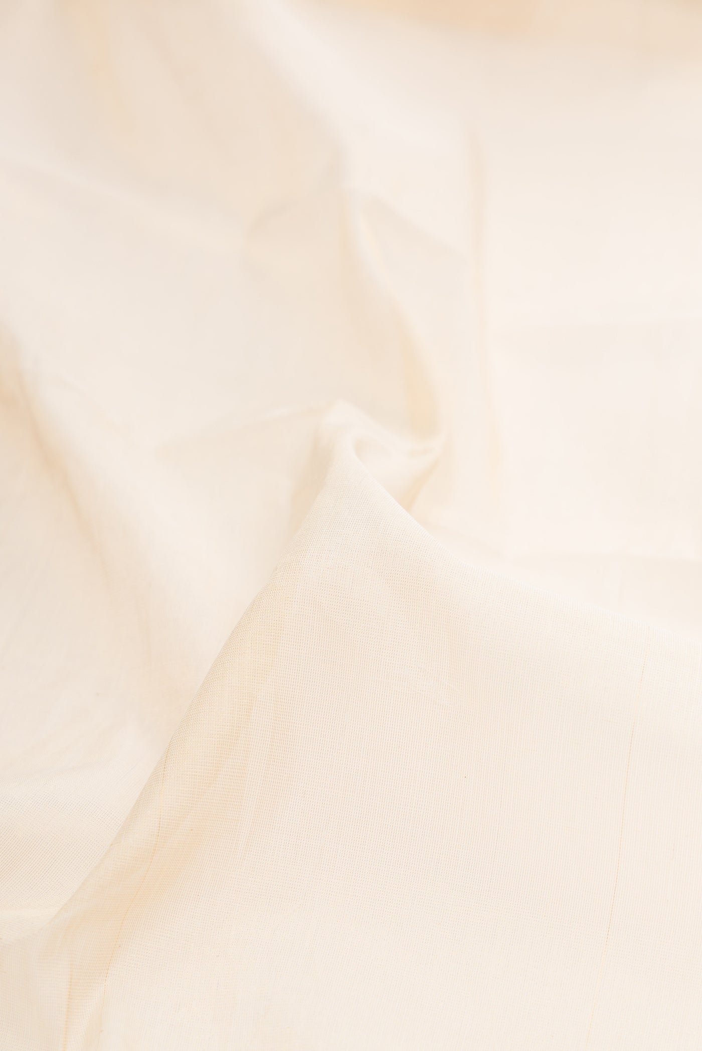 Close up of Off White Kerala Cotton Saree with Plain Body and Temple Border.  displaying folds