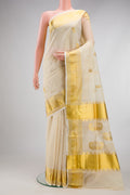 Off White Kerala Cotton Saree with Zari Butta on the body and Temple Border.  displayed on a mannequin
