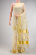Off White Kerala Cotton Saree with Zari Butta on the body and Zari Border.  displayed on a mannequin