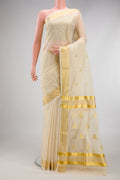 Off White Kerala Cotton Saree with Zari Butta on the body and Zari Border.  displayed on a mannequin