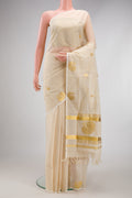 Off White Kerala Cotton Saree with Zari Butta on the body and Fancy Border.  displayed on a mannequin