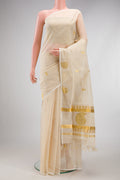 Off White Kerala Cotton Saree with Zari Butta on the body and Without Border.  displayed on a mannequin