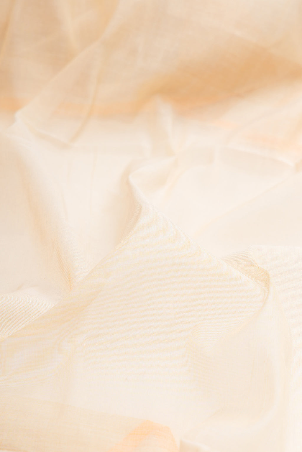 Close up of Off White Kerala Cotton Saree with Plain Body and Temple Border.  displaying folds