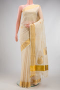 Off White Kerala Cotton Saree with Zari Butta on the body and Zari Border.  displayed on a mannequin