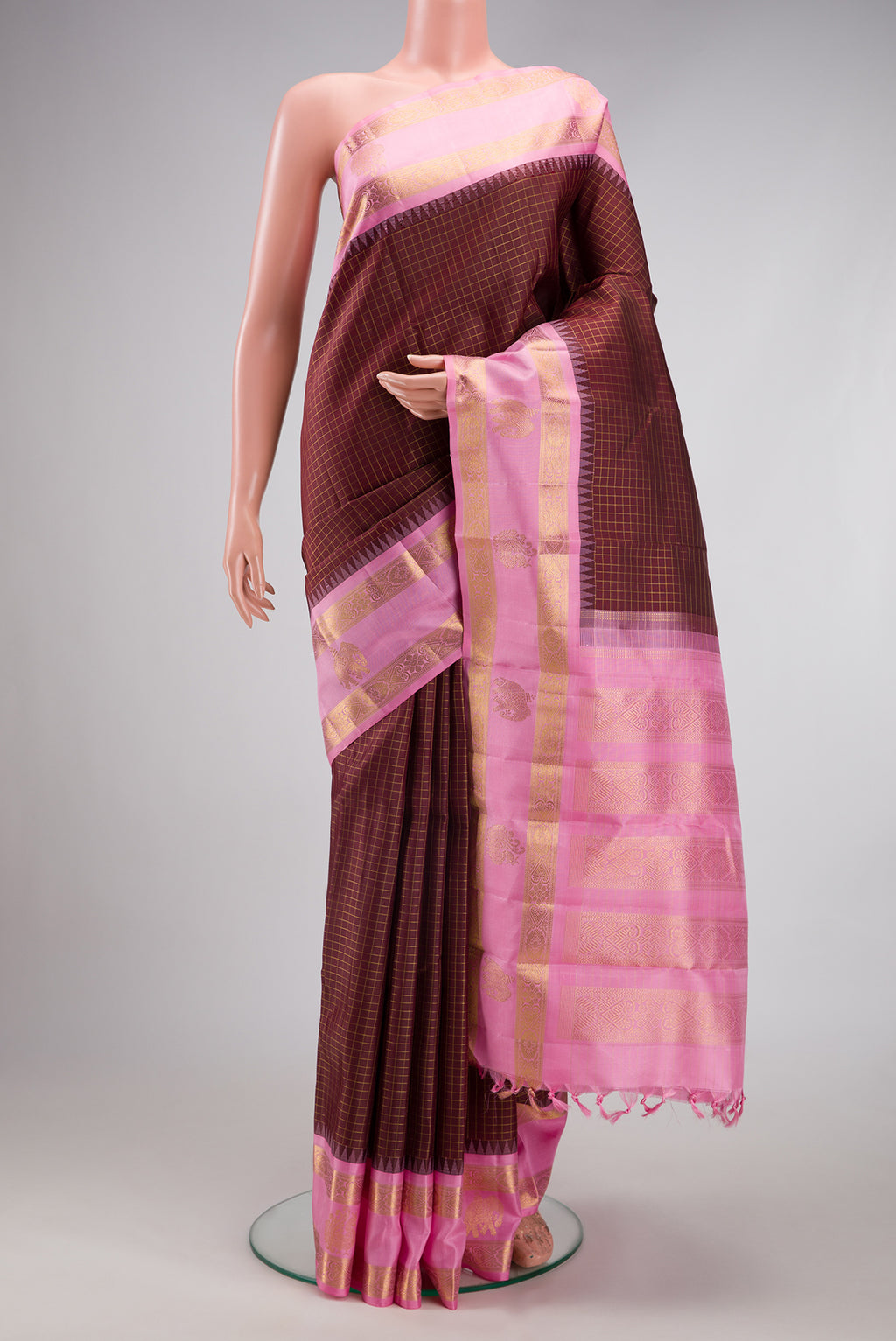Pure Silk Pure Zari Coffee Brown Kanchipuram Saree with Checked design on the body and Fancy Border.  displayed on a mannequin