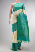 Pure Silk Pure Zari Off White Kanchipuram Saree with Checked design on the body and Zari Border.  displayed on a mannequin