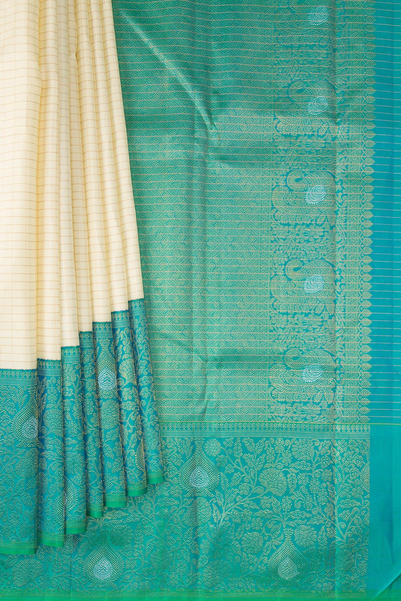 Pleats and pallu of Pure Silk Pure Zari Off White Kanchipuram Saree with Checked design on the body and Zari Border. 