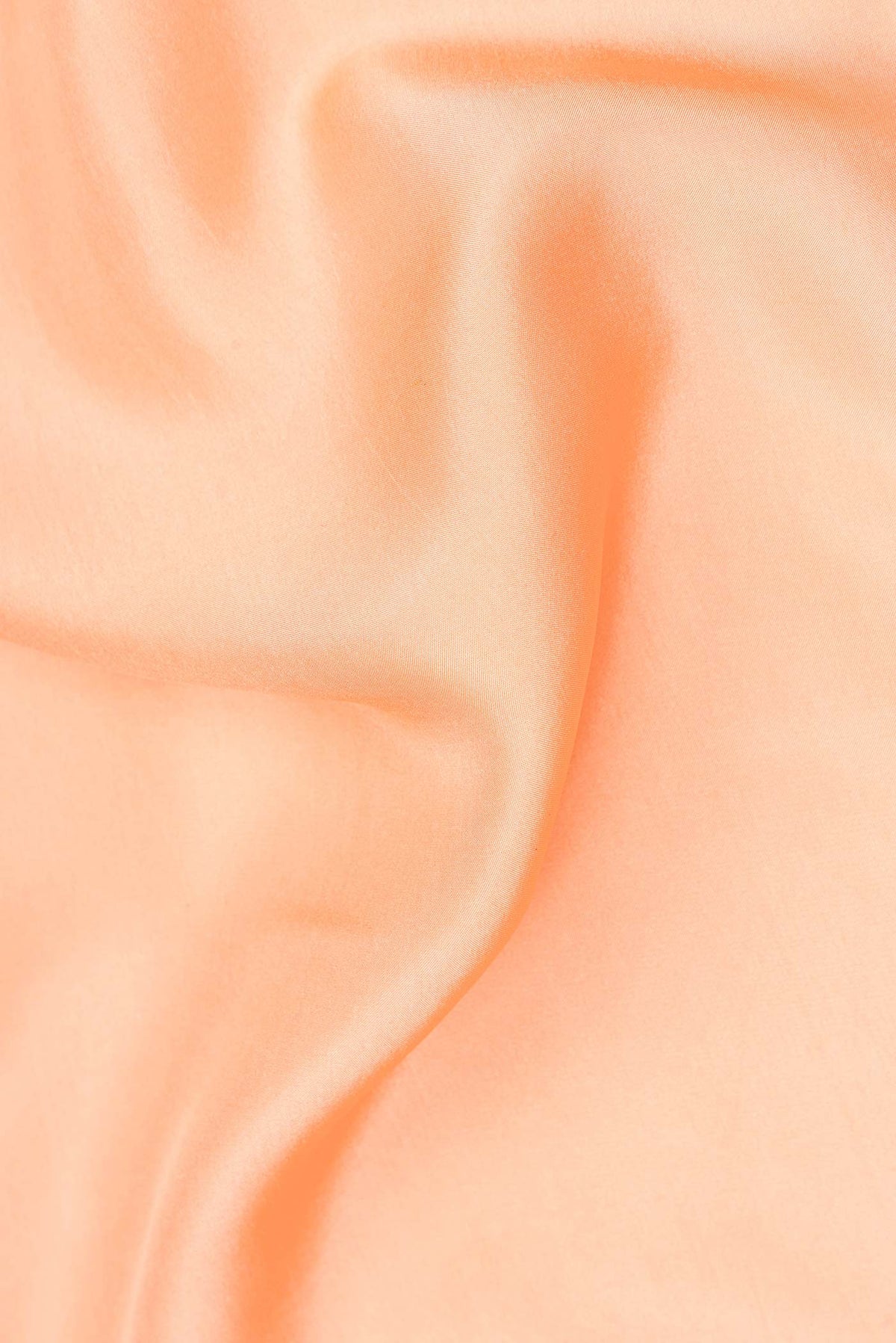 Close up of Pure Silk Pure Zari Golden Peach Mysore Silk Saree with Plain Body and Zari Border.  displaying folds