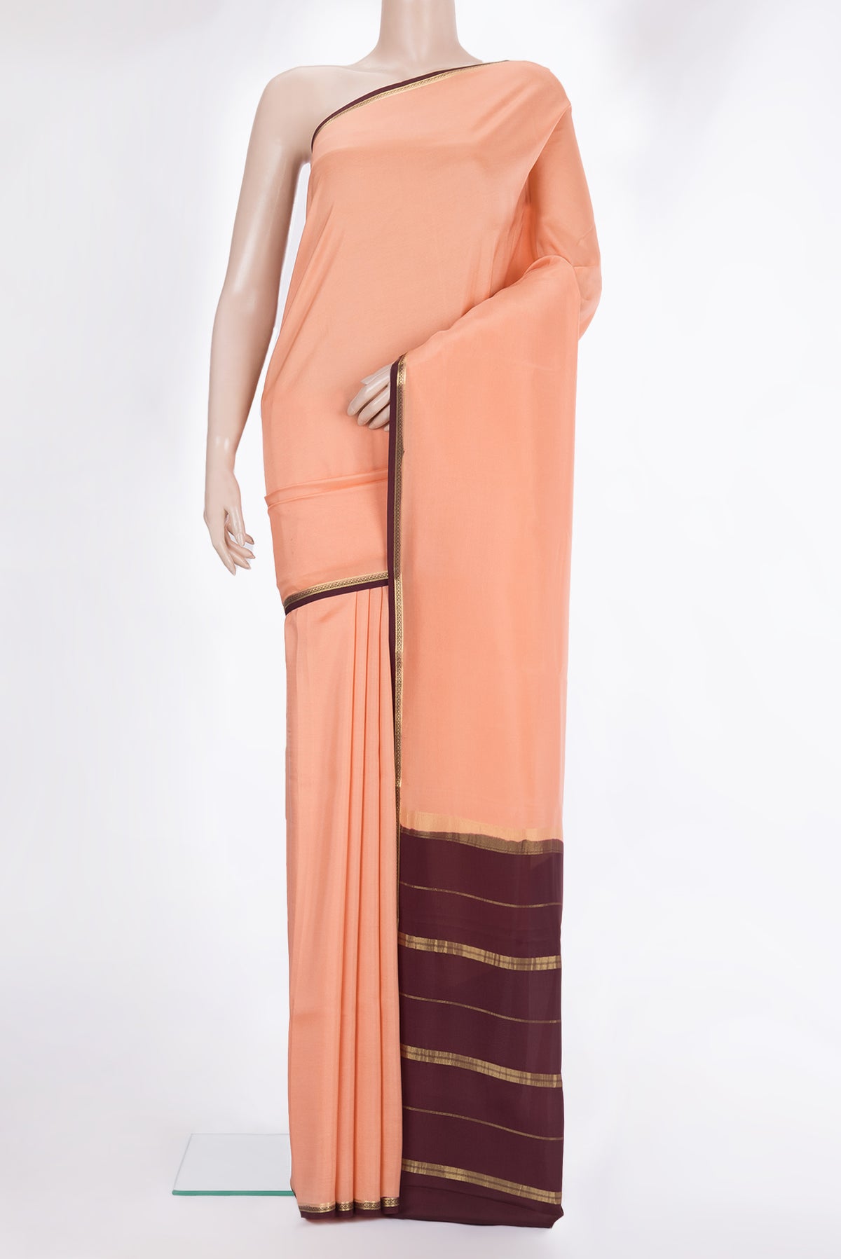 Pure Silk Pure Zari Golden Peach Mysore Silk Saree with Plain Body and Zari Border.  displayed on a mannequin