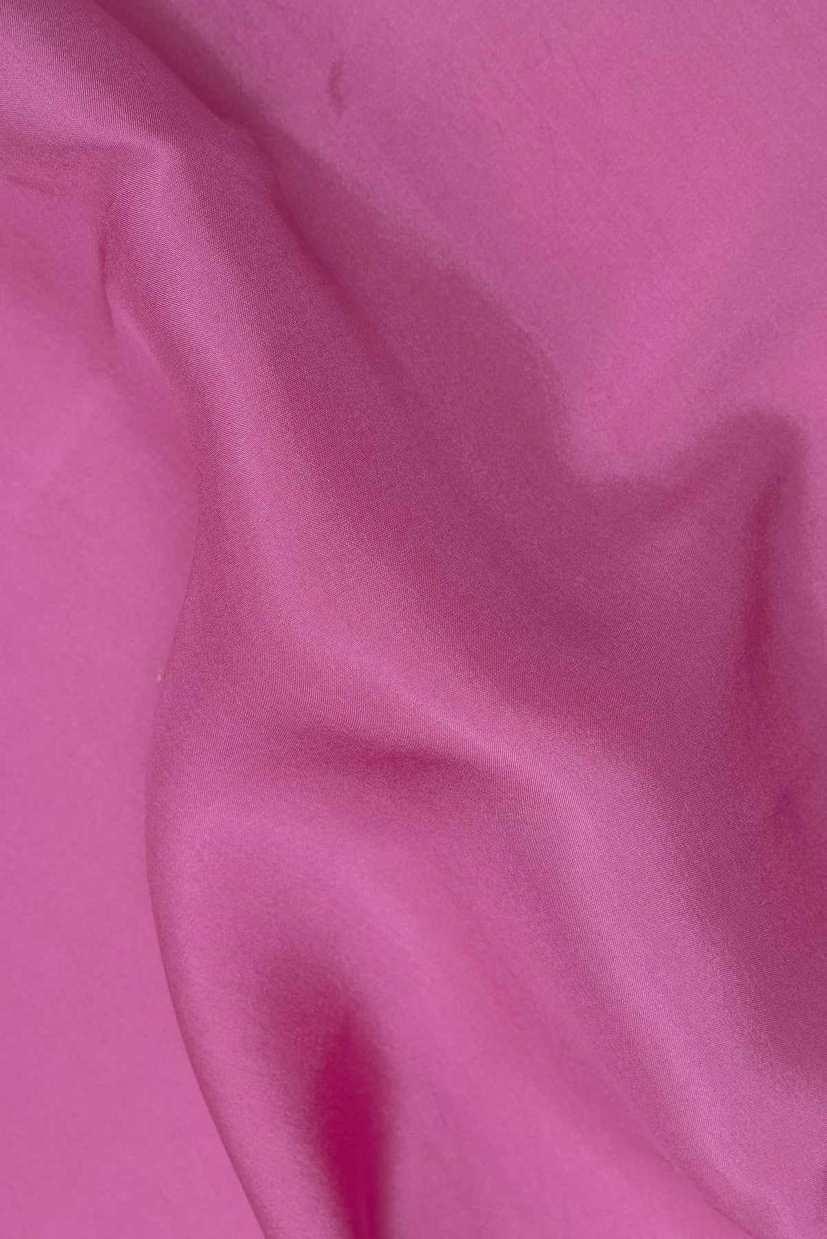 Close up of Pure Silk Pure Zari Pink Mysore Silk Saree with Plain Body and Zari Border.  displaying folds