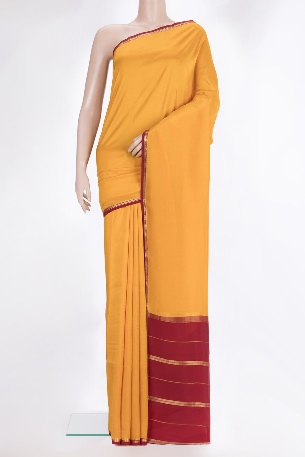 Pure Silk Pure Zari Yellow Mysore Silk Saree with Plain Body and Zari Border.  displayed on a mannequin