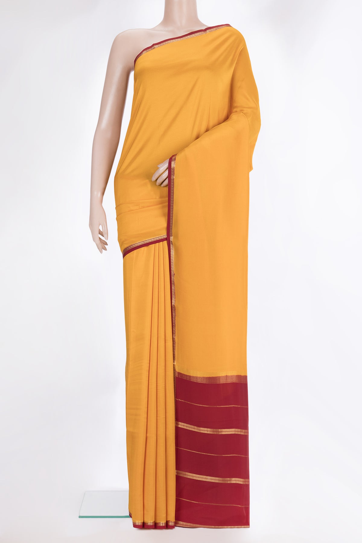 Pure Silk Pure Zari Yellow Mysore Silk Saree with Plain Body and Zari Border.  displayed on a mannequin