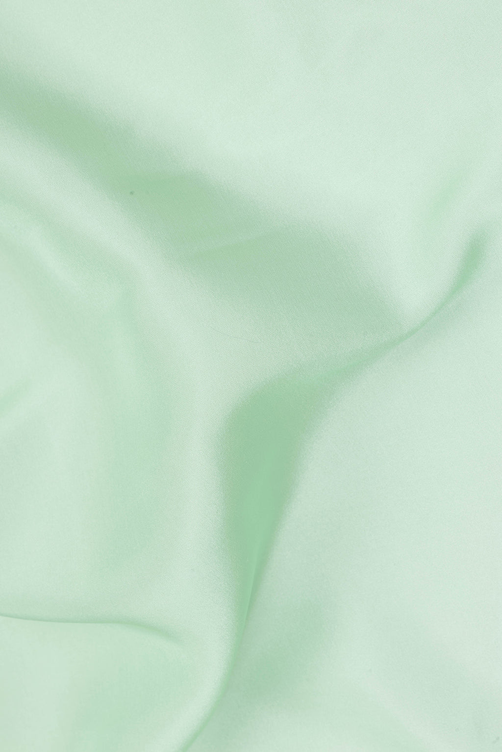 Close up of Pure Silk Pure Zari Pista Green Mysore Silk Saree with Plain Body and Zari Border.  displaying folds