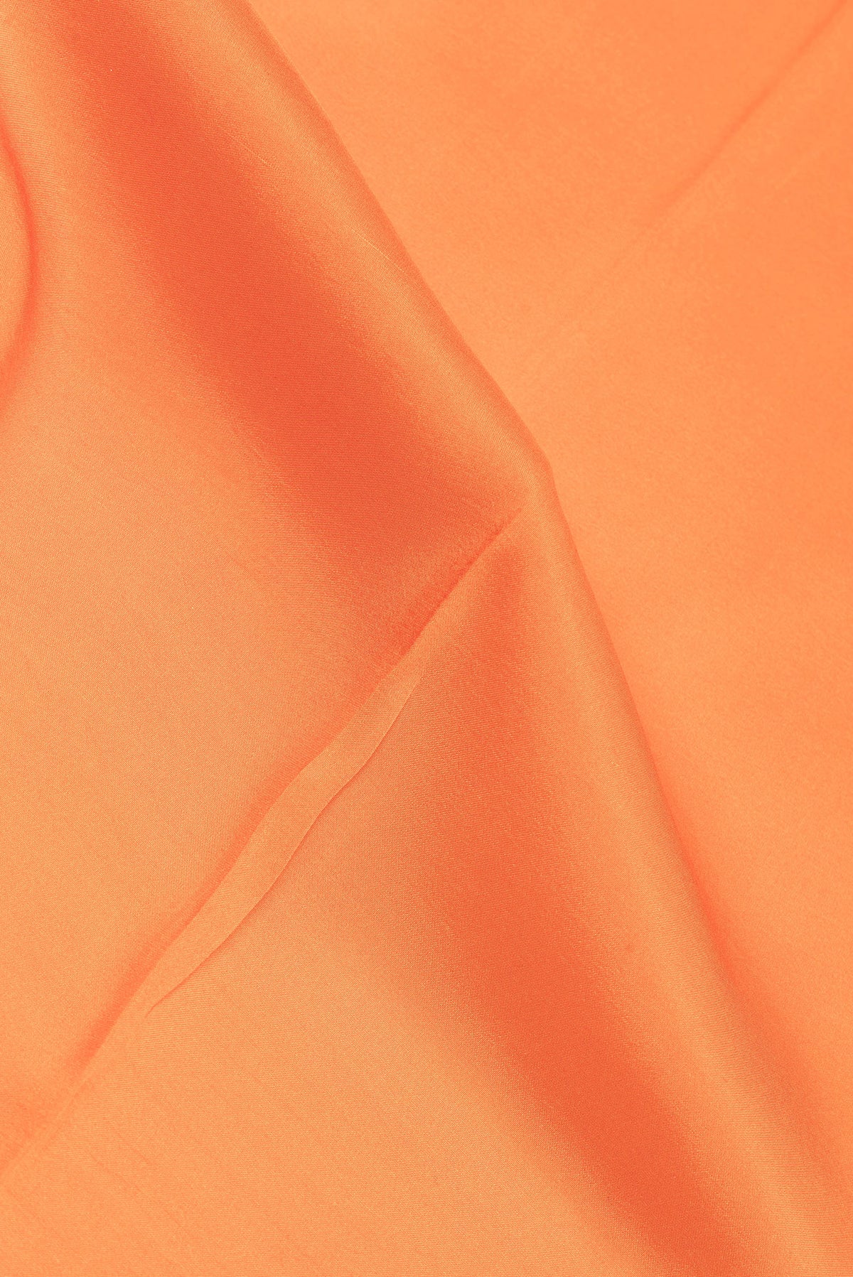 Close up of Pure Silk Pure Zari Orange Mysore Silk Saree with Plain Body and Zari Border.  displaying folds