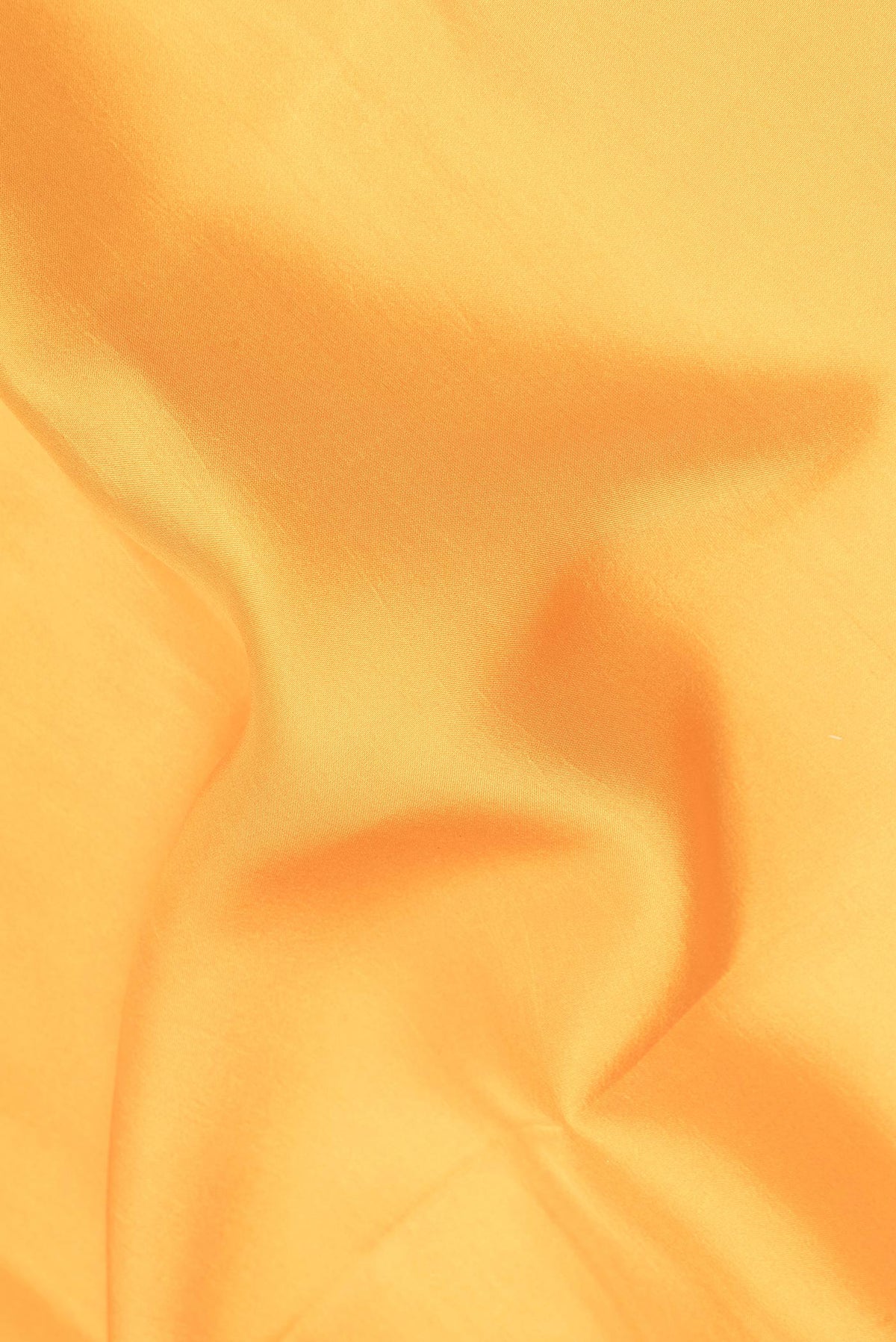 Close up of Pure Silk Pure Zari Mustard Mysore Silk Saree with Plain Body and Zari Border.  displaying folds