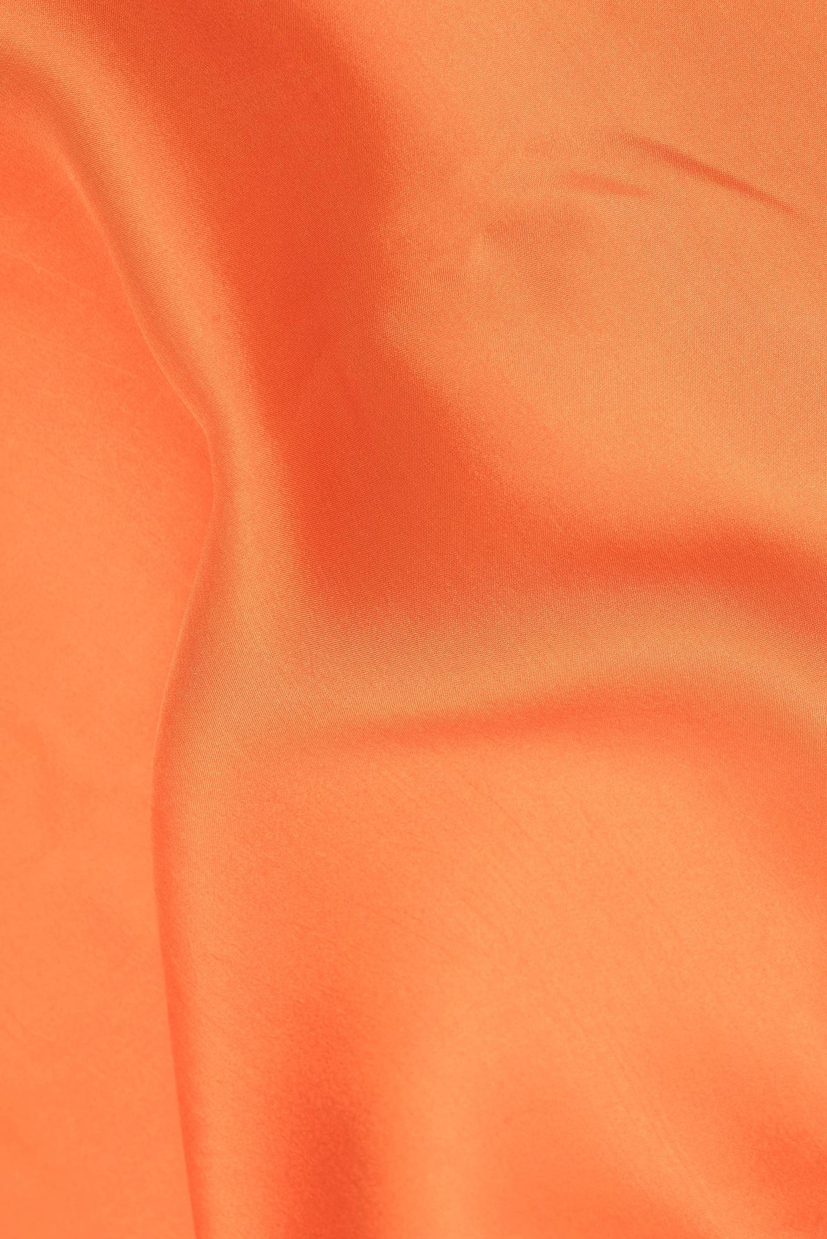 Close up of Pure Silk Pure Zari Orange Mysore Silk Saree with Plain Body and Zari Border.  displaying folds