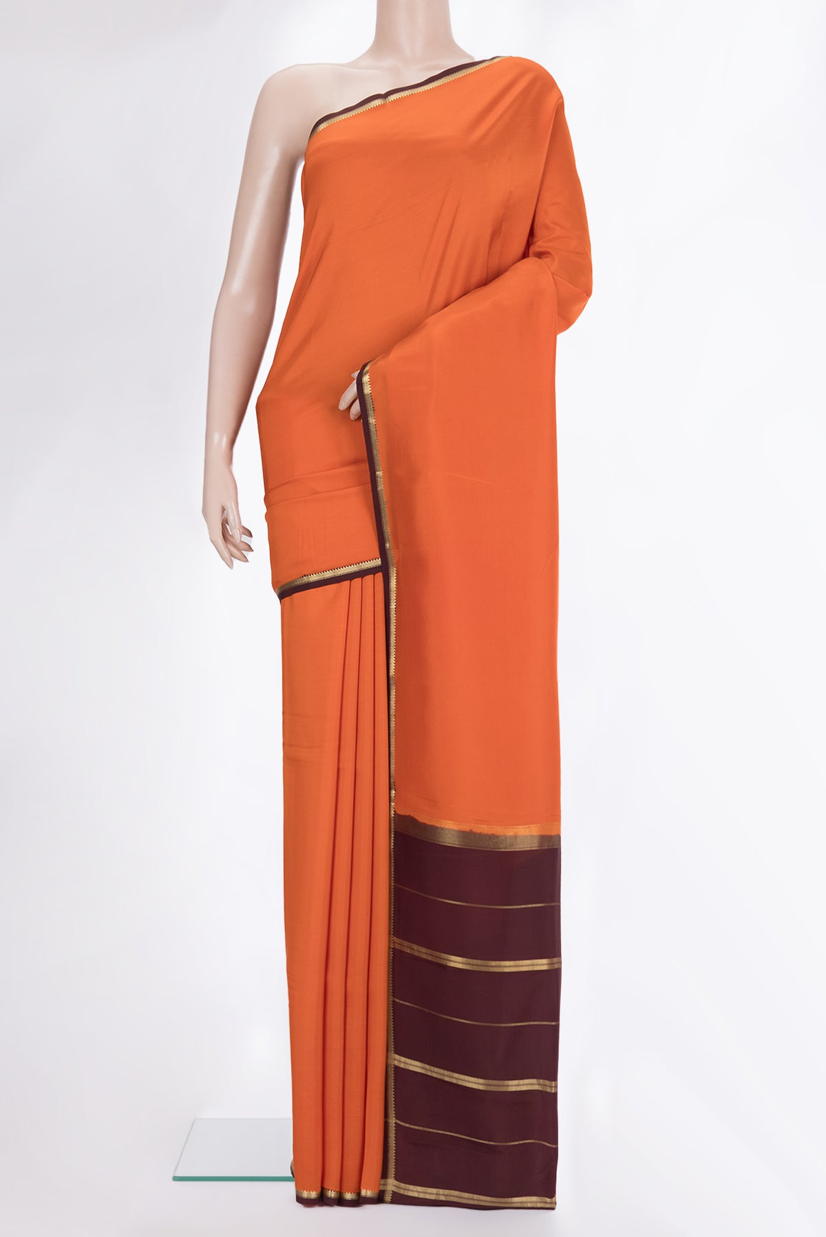 Pure Silk Pure Zari Orange Mysore Silk Saree with Plain Body and Zari Border.  displayed on a mannequin