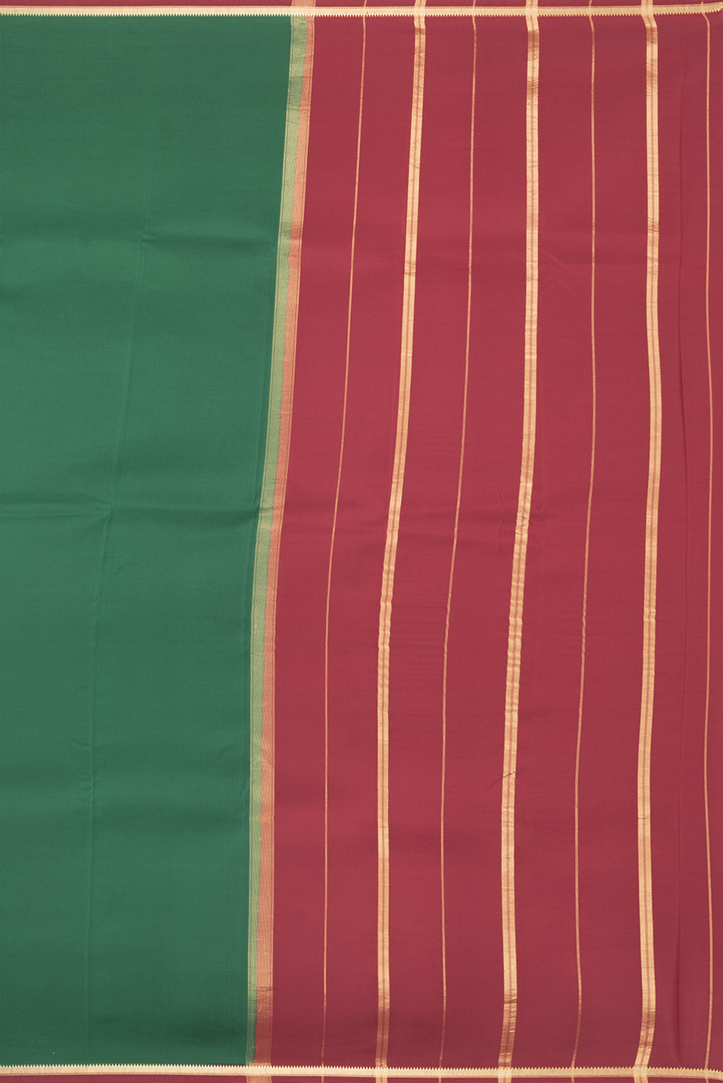 Close up image of the pallu of Pure Silk Pure Zari Bottle Green Mysore Silk Saree with Plain Body and Zari Border. 