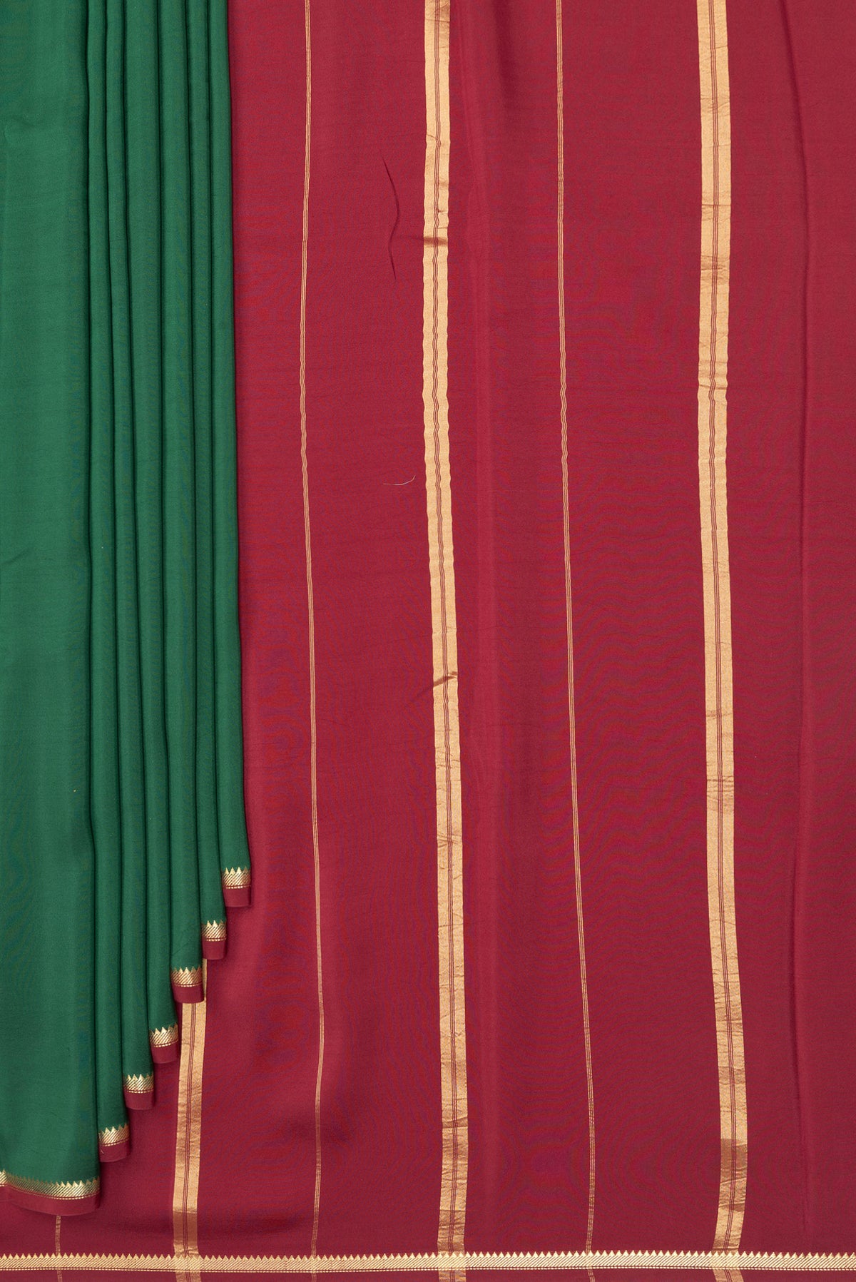 Pleats and pallu of Pure Silk Pure Zari Bottle Green Mysore Silk Saree with Plain Body and Zari Border. 