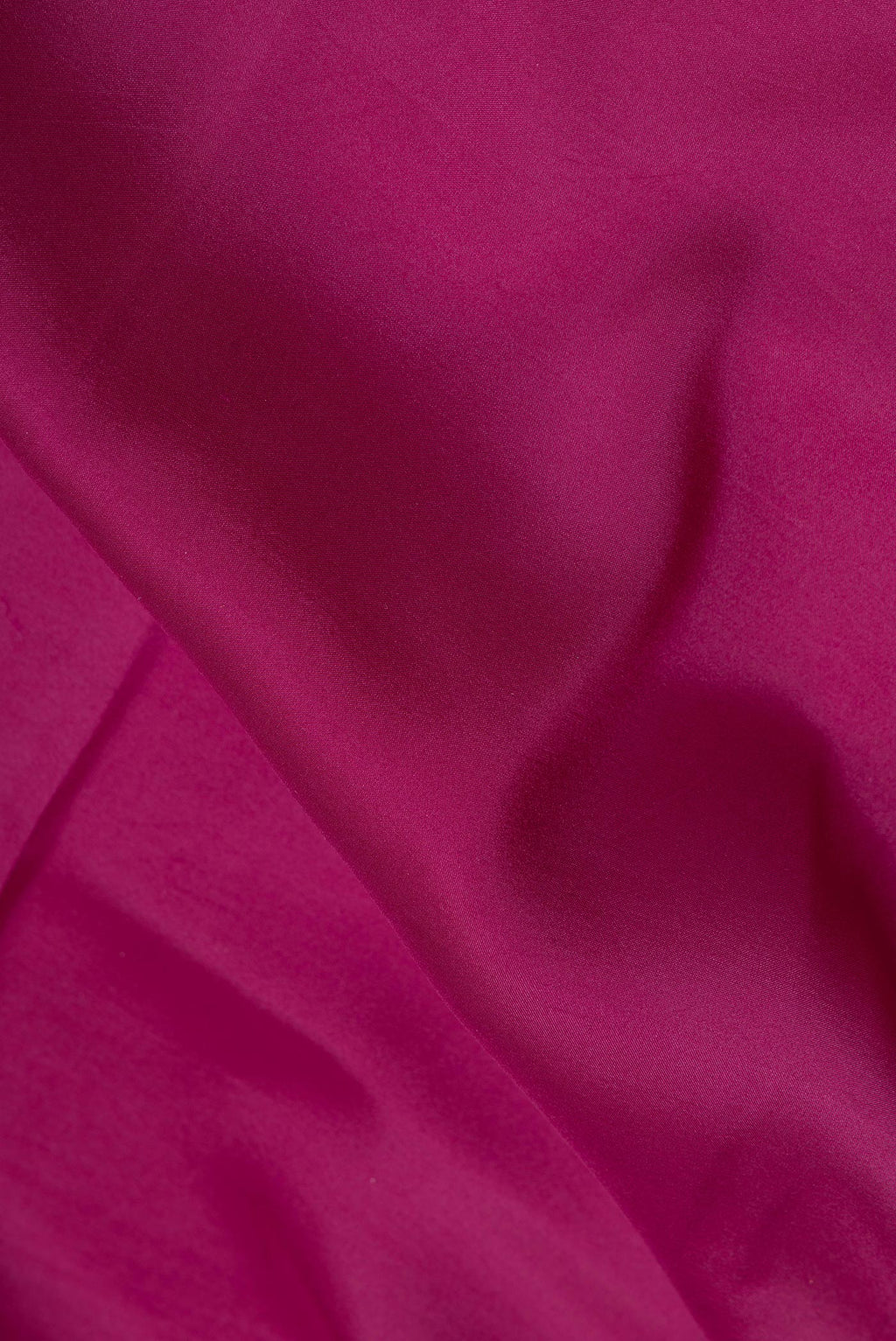 Close up of Pure Silk Pure Zari Magenta Dual Tone Mysore Silk Saree with Plain Body and Zari Border.  displaying folds