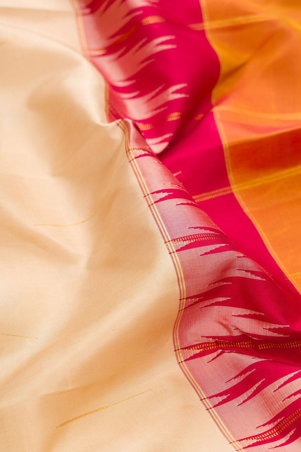 Close up of Pure Silk Multi Color Kanjivaram Saree with Half And Half on the body and Zari Border.  displaying folds