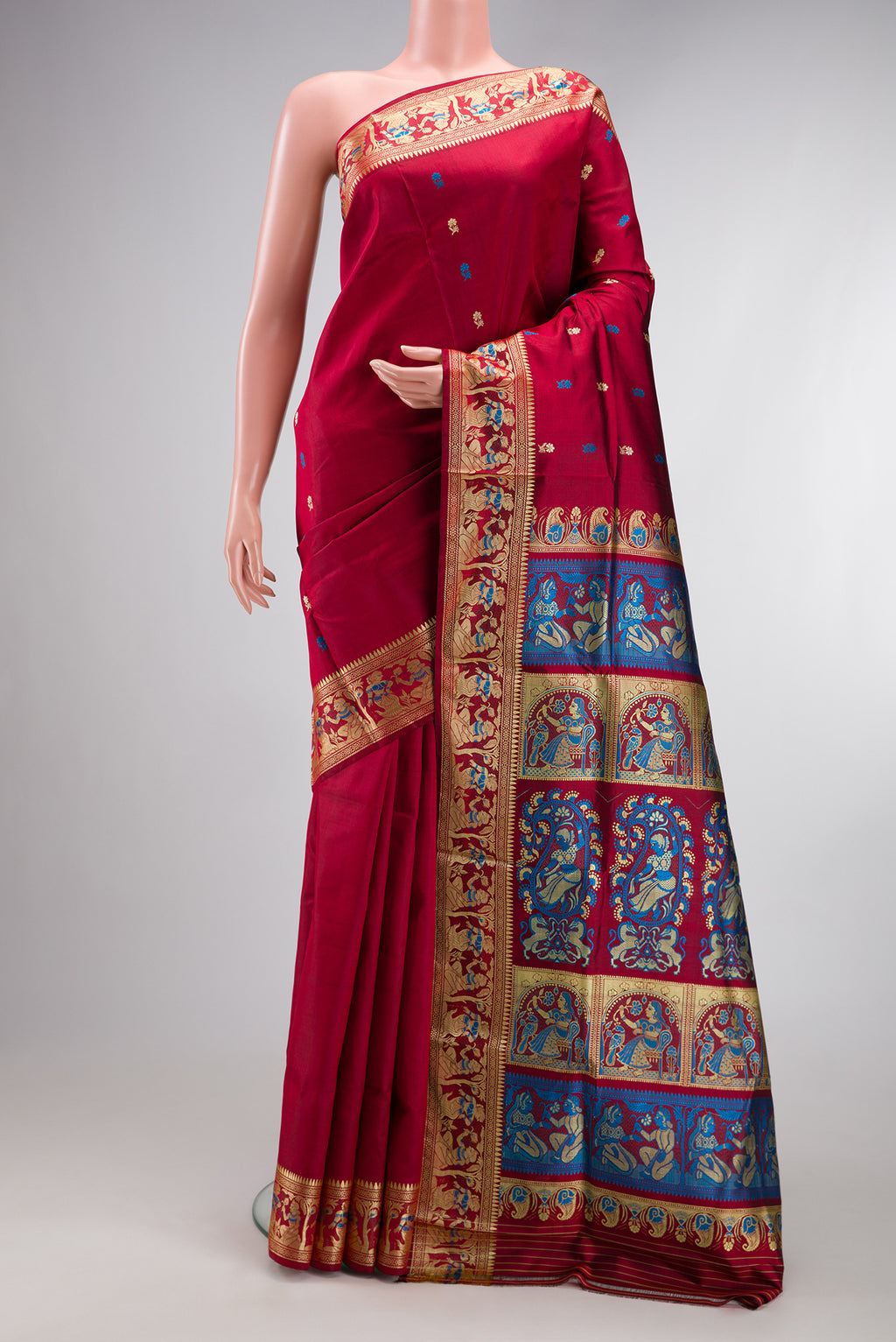 Maroon Baluchari Silk Saree with Thread Butta on the body and Thread Border.  displayed on a mannequin