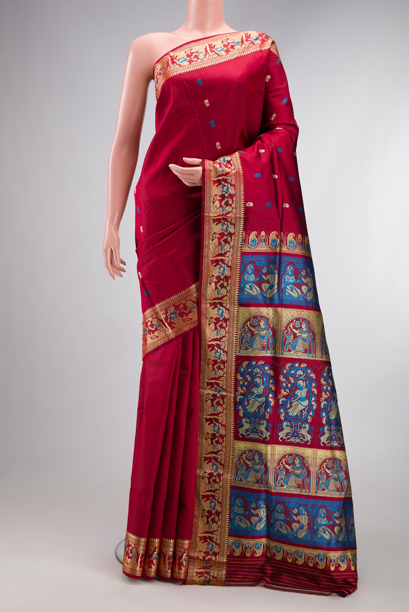 Maroon Baluchari Silk Saree with Thread Butta on the body and Thread Border.  displayed on a mannequin