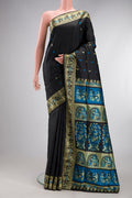 Black Baluchari Silk Saree with Thread Butta on the body and Thread Border.  displayed on a mannequin