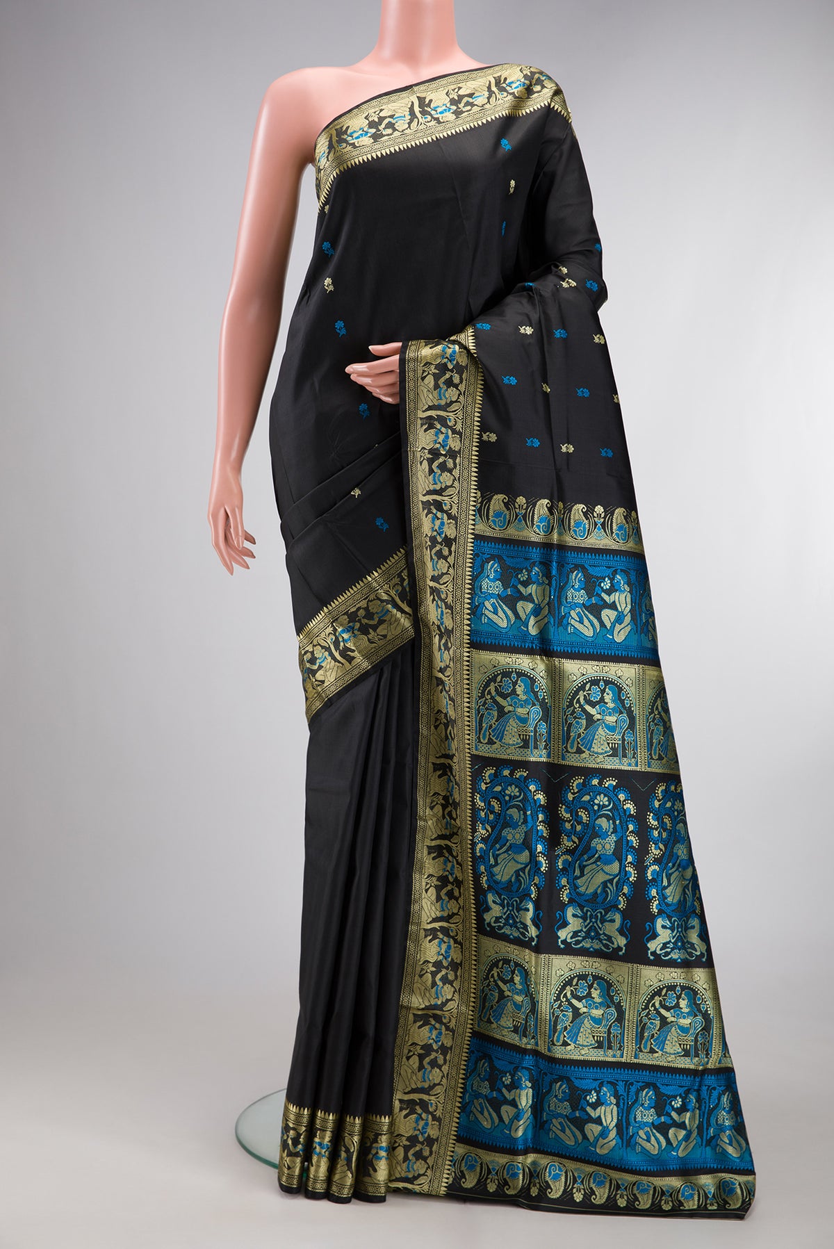 Black Baluchari Silk Saree with Thread Butta on the body and Thread Border.  displayed on a mannequin