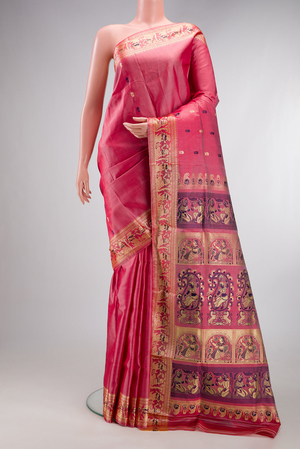 Coral Baluchari Silk Saree with Thread Butta on the body and Thread Border.  displayed on a mannequin