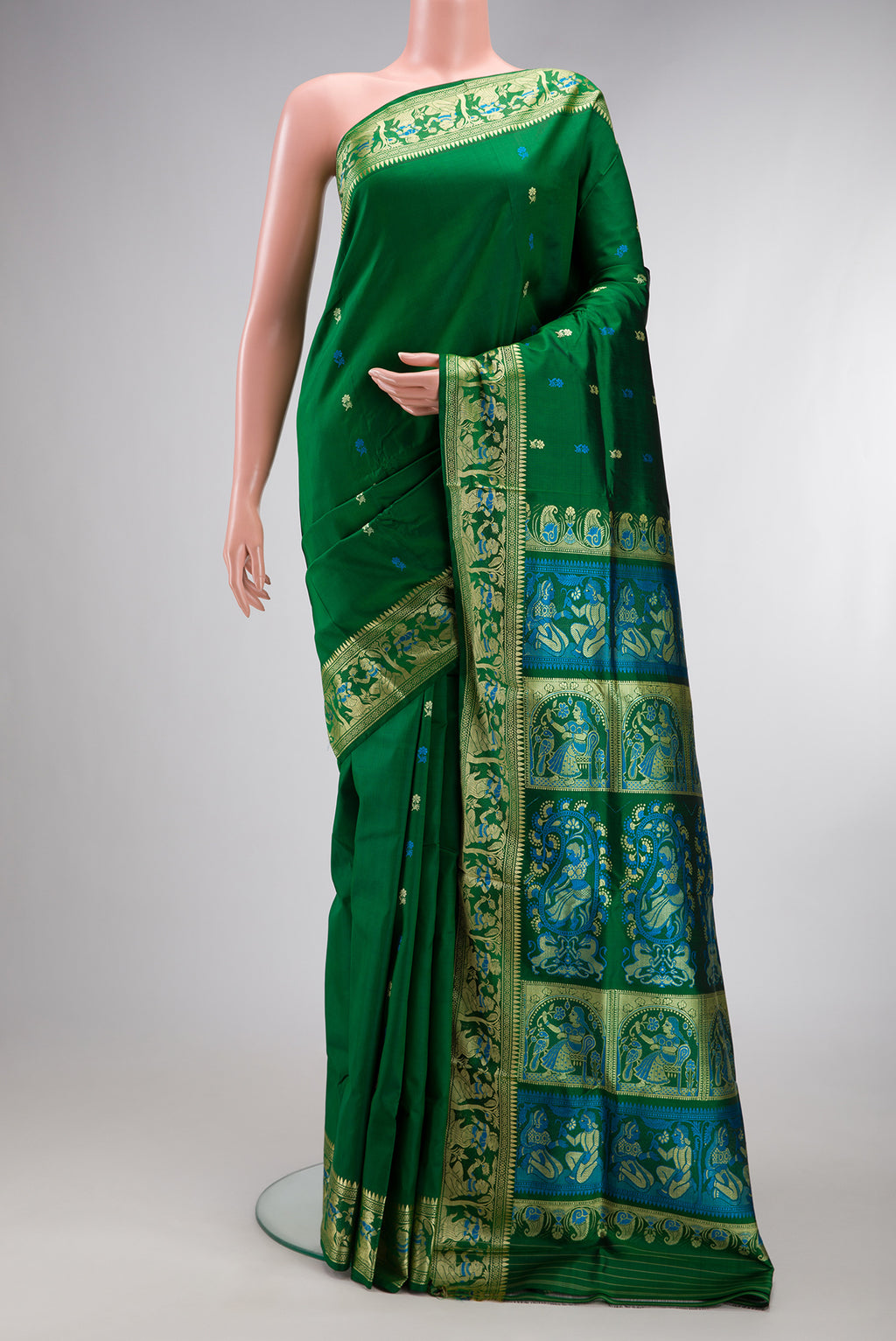 Green Baluchari Silk Saree with Thread Butta on the body and Thread Border.  displayed on a mannequin