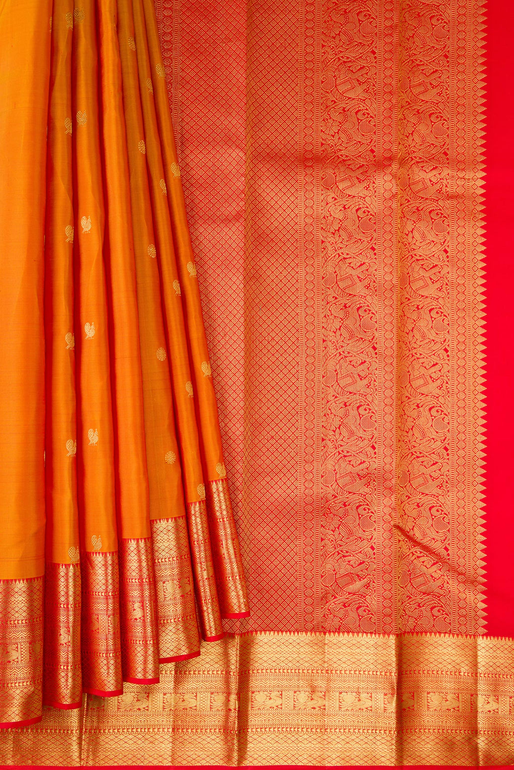 Pleats and pallu of Pure Silk Mustard Dual Tone Kanjivaram Saree with Zari Butta on the body and Zari Border. 