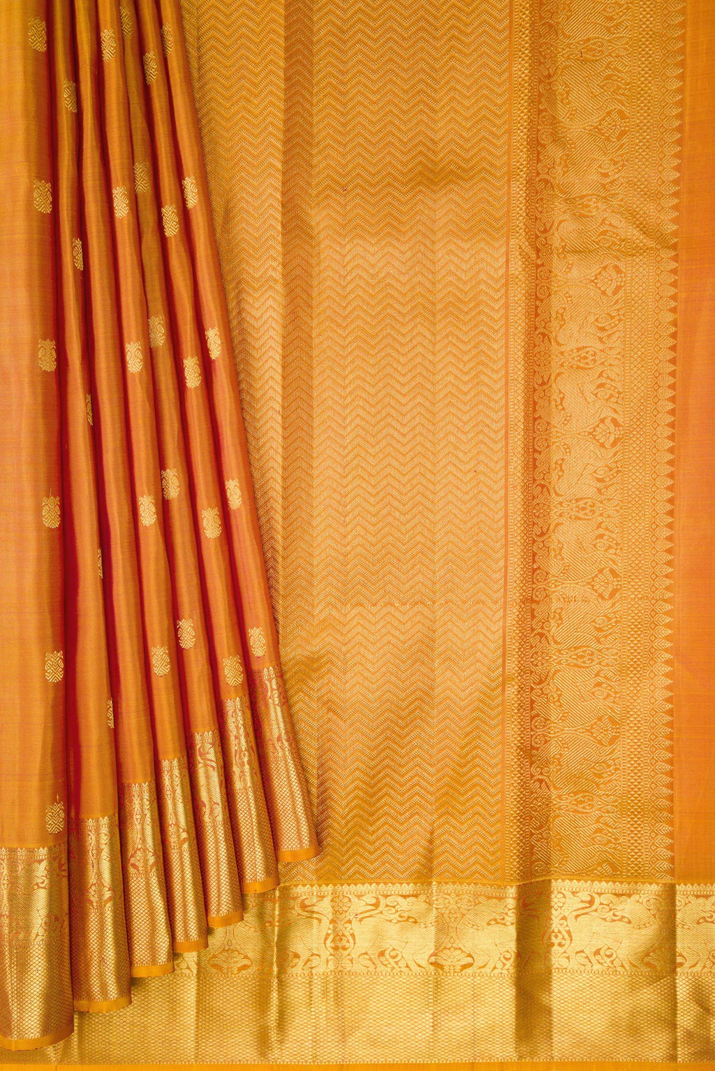 Pleats and pallu of Mustard Dual Tone Kanjivaram Silk Saree with Zari Butta on the body and Zari Border. 