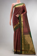 Pure Silk Maroon Kanchipuram Saree with Checked design on the body and Zari Border.  displayed on a mannequin