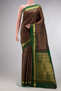Pure Silk Coffee Brown Kanchipuram Saree with Checked design on the body and Zari Border.  displayed on a mannequin