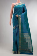Pure Silk Peacock Blue Dual Tone Kanchipuram Saree with Checked design on the body and Zari Border.  displayed on a mannequin