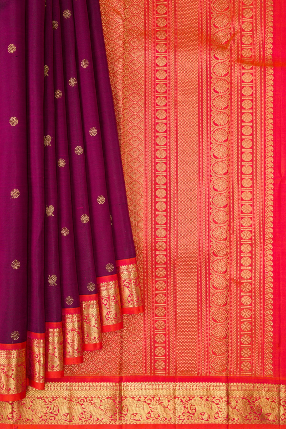 Pleats and pallu of Pure Silk Maroon Kanchipuram Saree with Zari Butta on the body and Zari Border. 