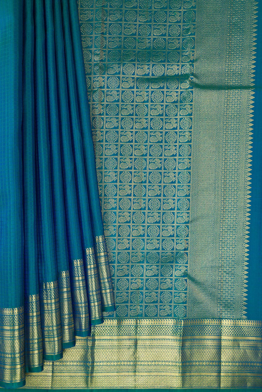 Pleats and pallu of Pure Silk Peacock Blue Kanchipuram Saree with Checked design on the body and Zari Border. 