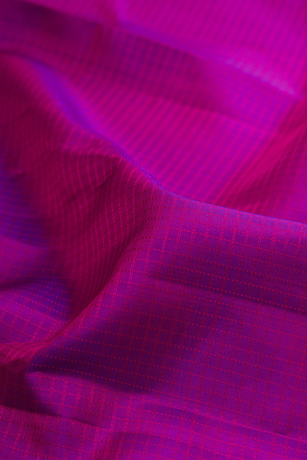 Close up of Pure Silk Purple Kanchipuram Saree with Checked design on the body and Zari Border.  displaying folds
