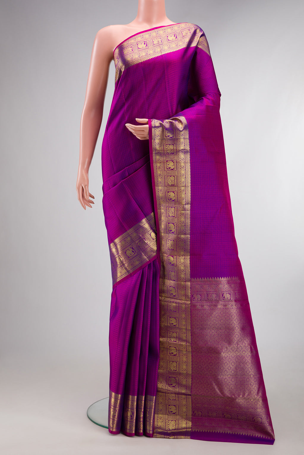 Pure Silk Purple Kanchipuram Saree with Checked design on the body and Zari Border.  displayed on a mannequin