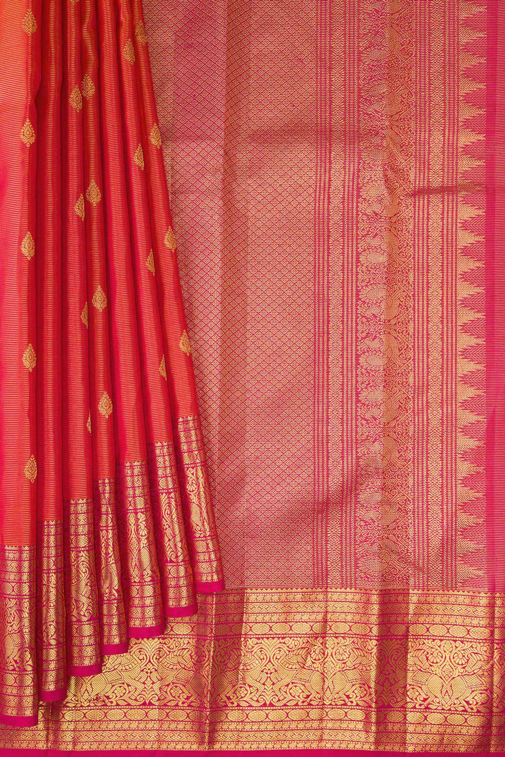 Pleats and pallu of Pure Silk Coral Dual Tone Kanchipuram Saree with Zari Butta on the body and Zari Border. 