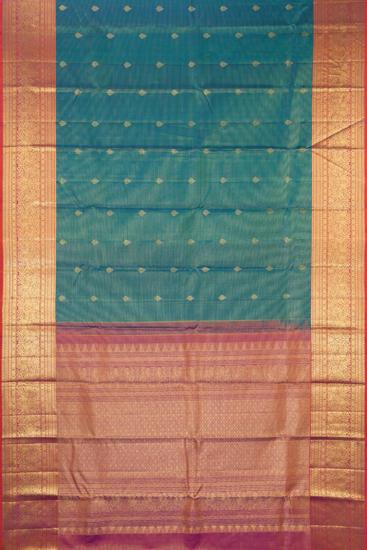 Flat view of Pure Silk Peacock Blue Dual Tone Kanchipuram Saree with Stripes on the body and Zari Border. 