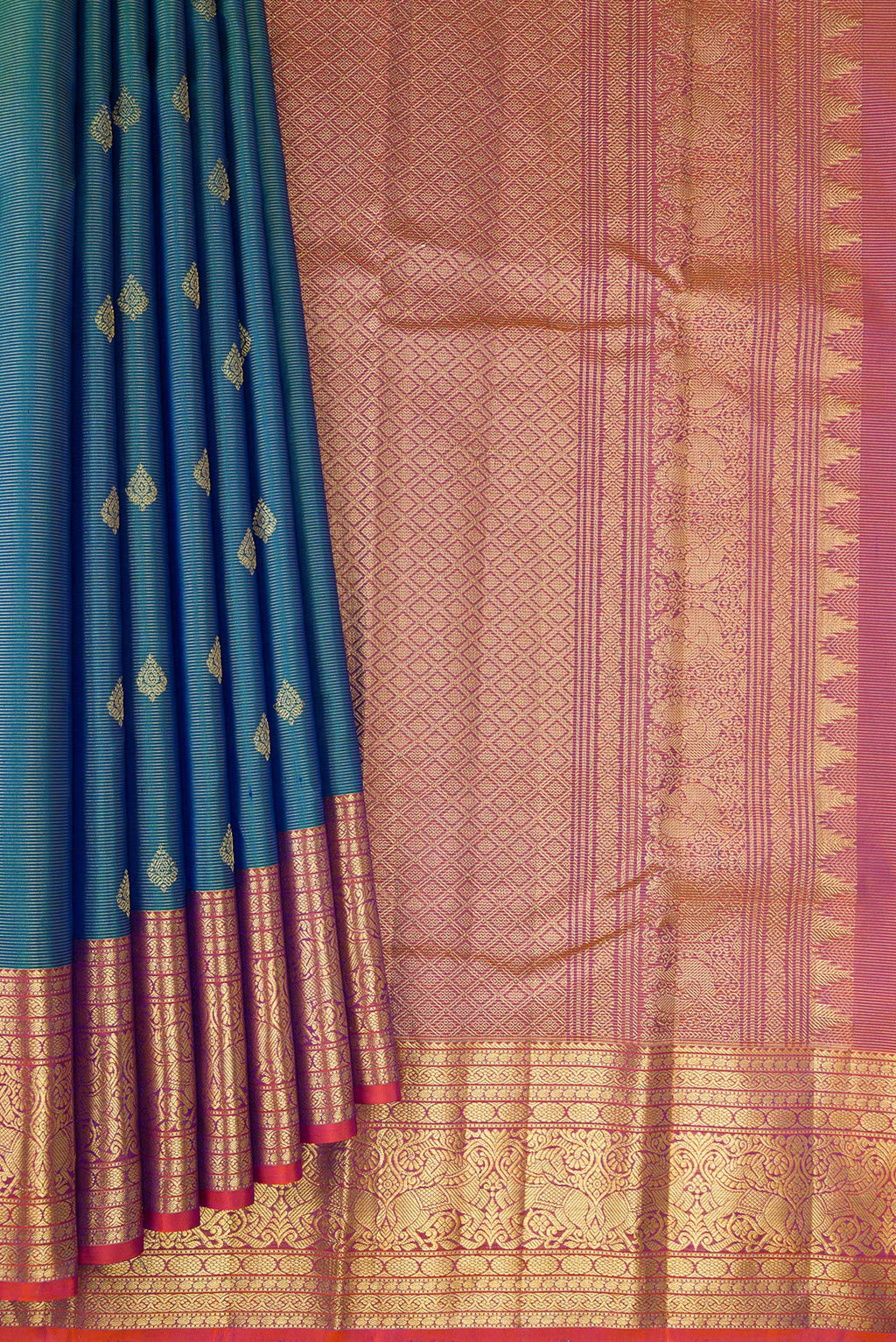 Pleats and pallu of Pure Silk Peacock Blue Dual Tone Kanchipuram Saree with Stripes on the body and Zari Border. 