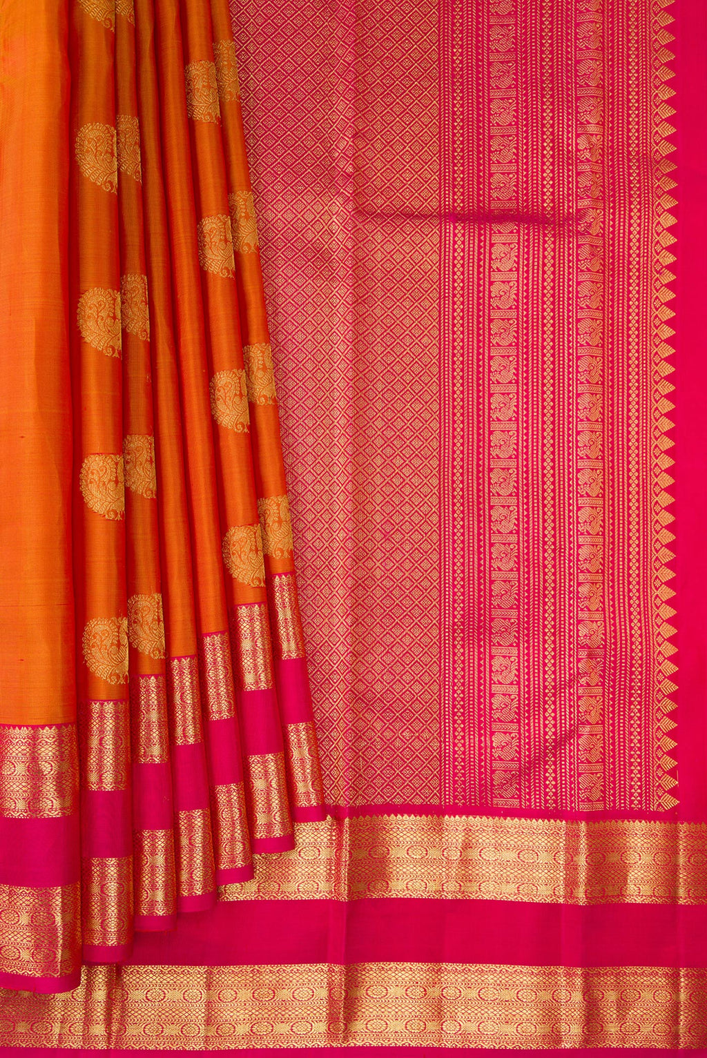 Pleats and pallu of Pure Silk Mustard Kanchipuram Saree with Zari Butta on the body and Zari Border. 