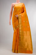 Pure Silk Mustard Kanchipuram Saree with Zari Butta on the body and Zari Border.  displayed on a mannequin