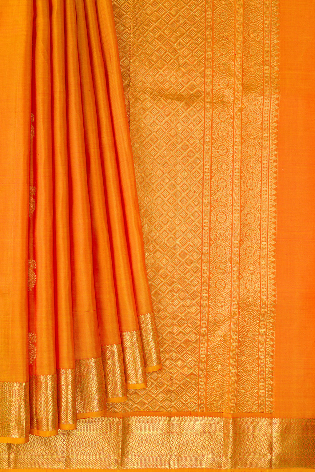 Pleats and pallu of Pure Silk Mustard Kanchipuram Saree with Zari Butta on the body and Zari Border. 