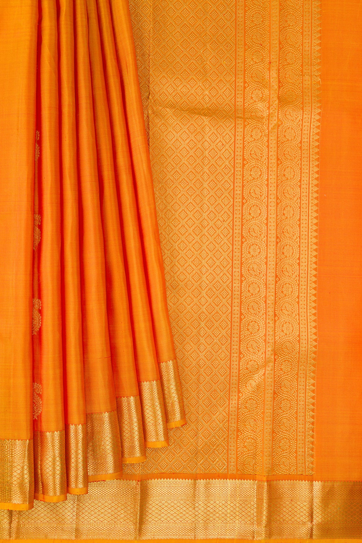 Pleats and pallu of Pure Silk Mustard Kanchipuram Saree with Zari Butta on the body and Zari Border. 