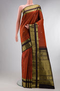 Pure Silk Rust Kanchipuram Saree with Checked design on the body and Zari Border.  displayed on a mannequin