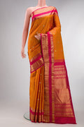 Pure Silk Mustard Kanchipuram Saree with Checked design on the body and Zari Border.  displayed on a mannequin